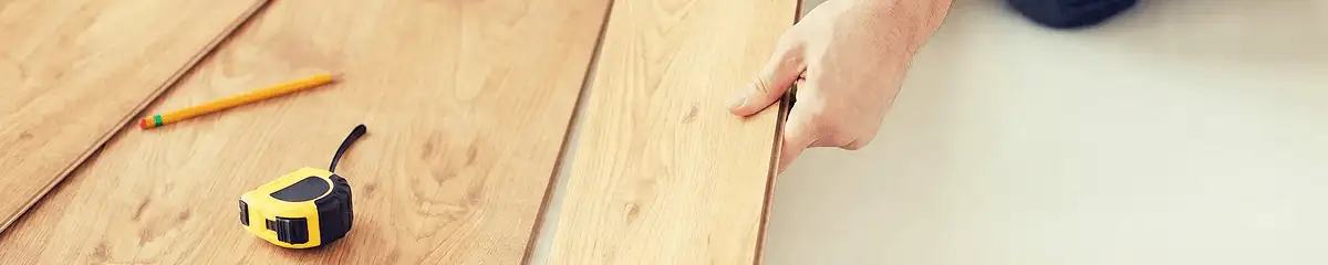 A professional installing wood flooring in Pasadena, CA