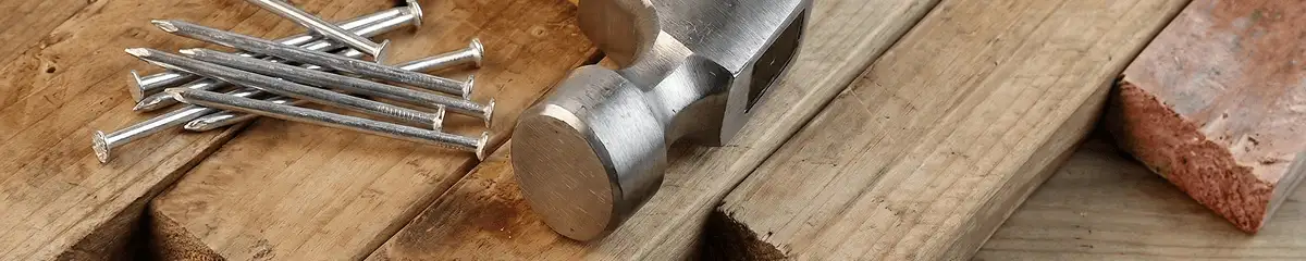 Hammer and nails on hardwood flooring boards in Pasadena, CA