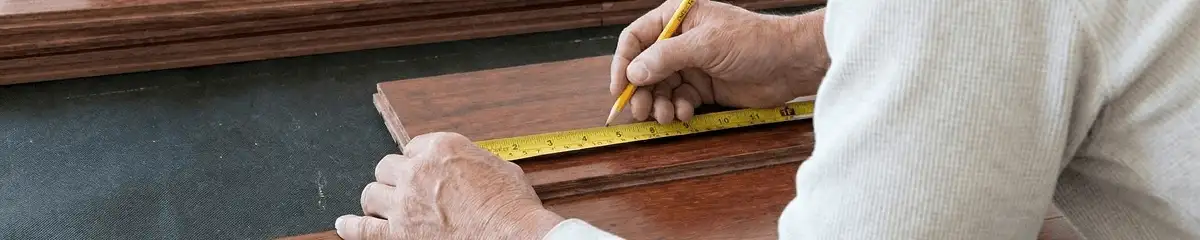 A professional installing wood flooring in Pasadena, CA